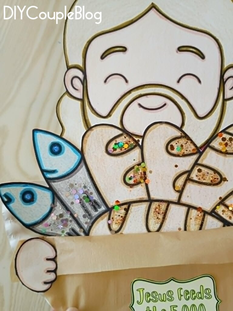 close up of printable loaves and fishes craft activity with a touch of glitter