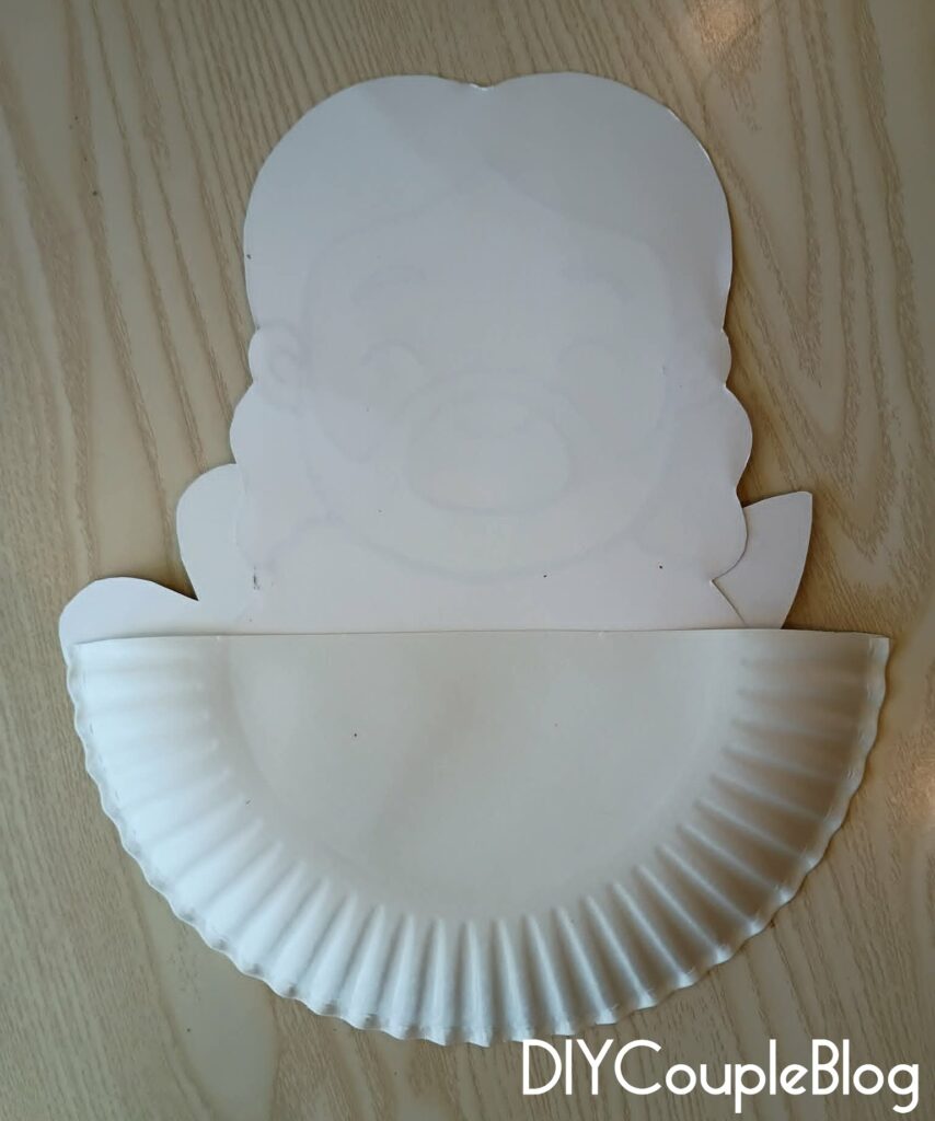 back of the loaves and fish craft where the printables were glued to the paper plate 