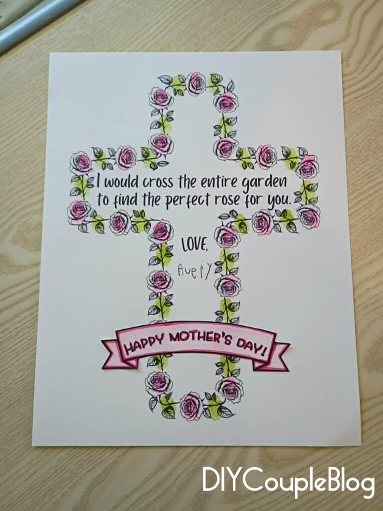 Mother's day printable cross with child's fingerprints added to the roses and signed with their handwritten name