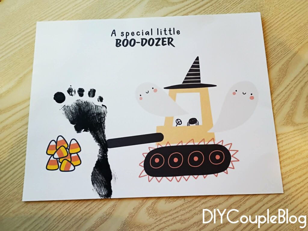 printable halloween craft with a spooky scene, a bulldozer aka "boo-dozer" with ghosts coming out and a baby or toddler footprint as the blade