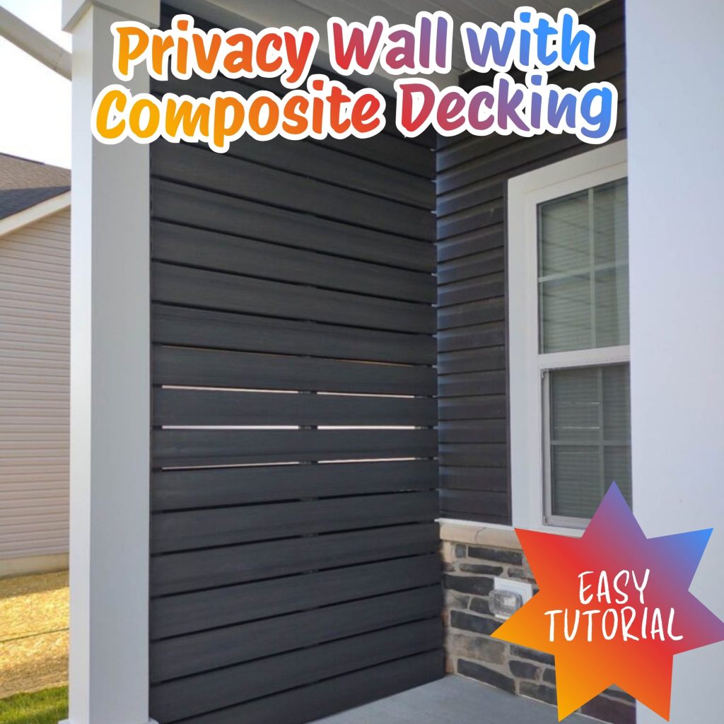 modern dark gray privacy wall featuring composite decking boards 