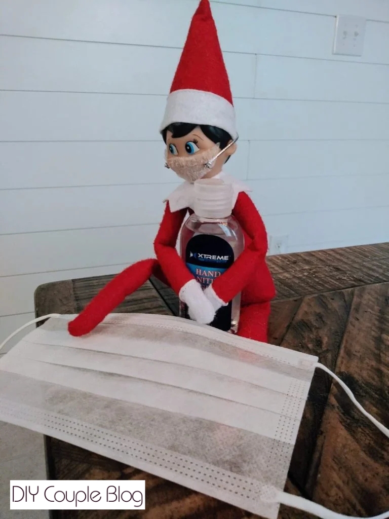 posing sick elf with a face mask on 