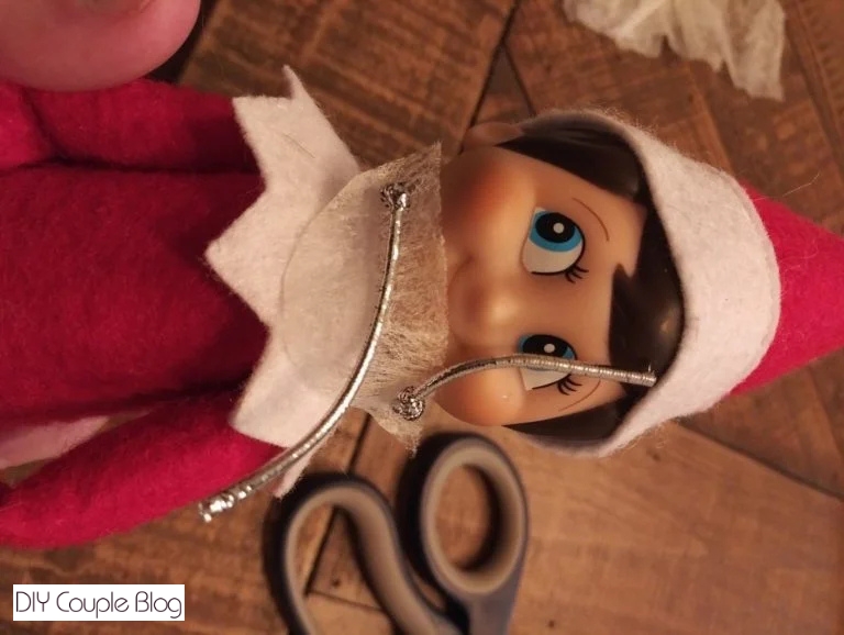 getting both knots tied and prepping to cut the extra off that's not needed
