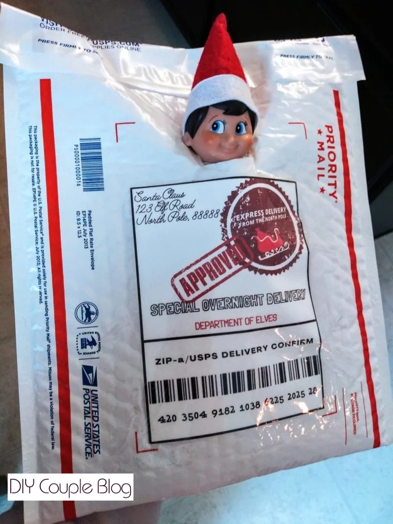 Holiday elf peeking his head of out package