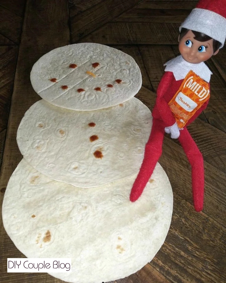 taco night elf on the shelf idea with tortillas to make a snowman