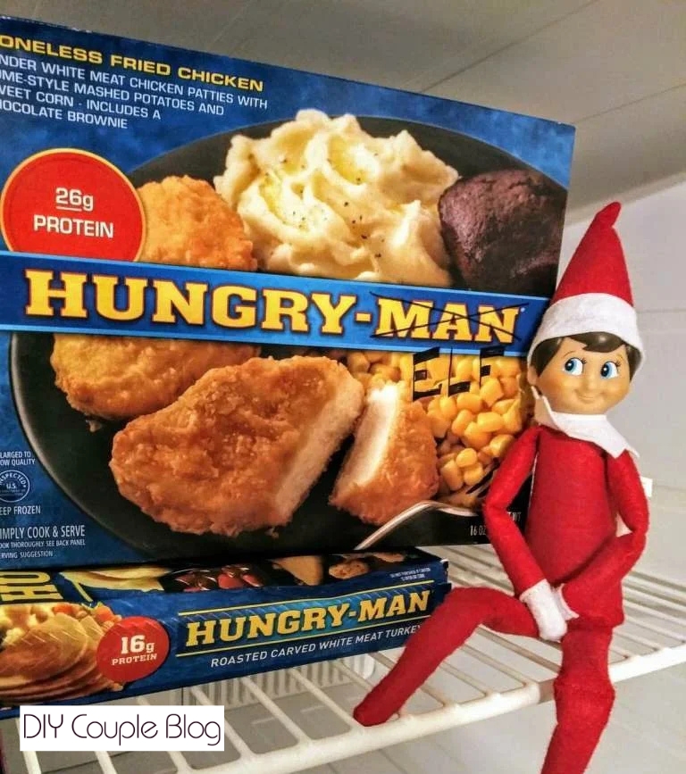 elf on the shelf DIY idea posing in the freezer being funny 