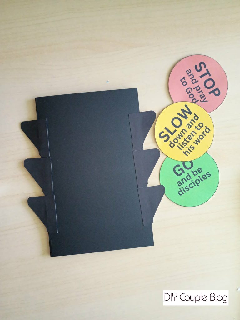 assembling the craft elements to the stoplight kids activity 