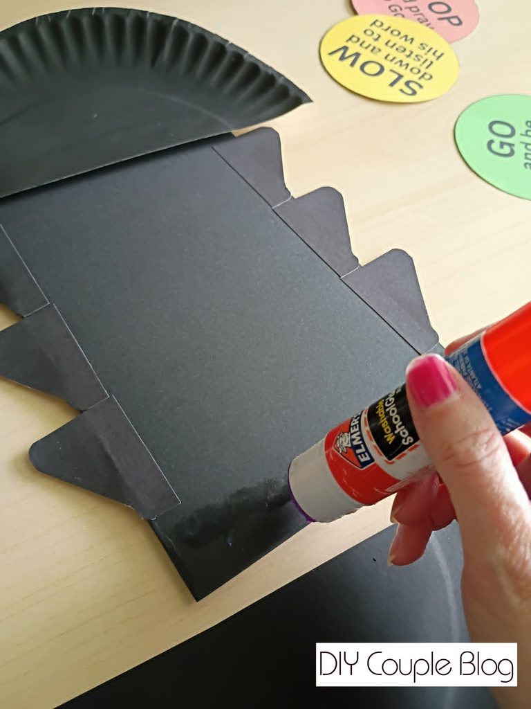 gluing the bottom paper plate 