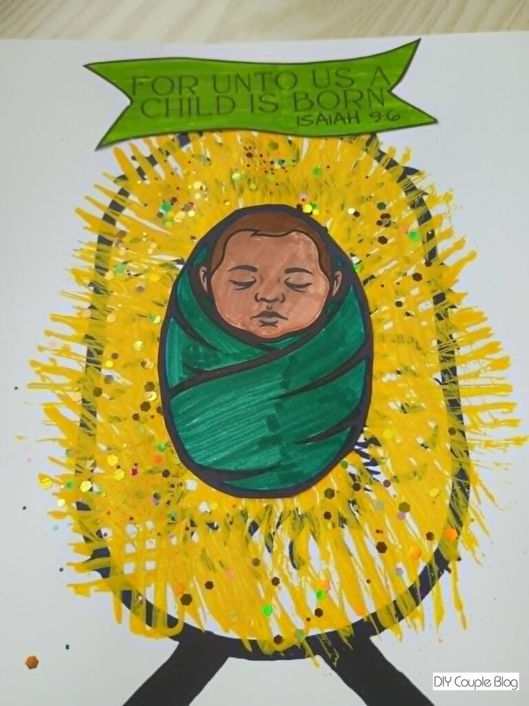 Jesus in a manger with yellow paint to look like straw
