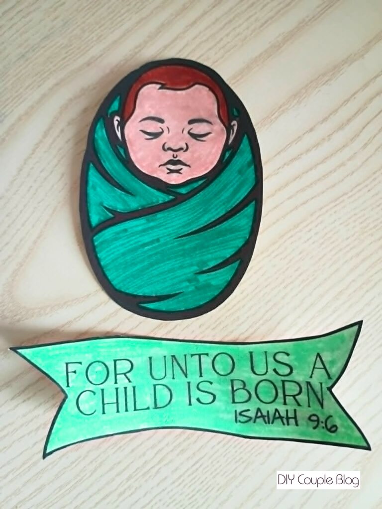 swaddled baby Jesus with scripture "for unto us a child is born" Isaiah 9:3