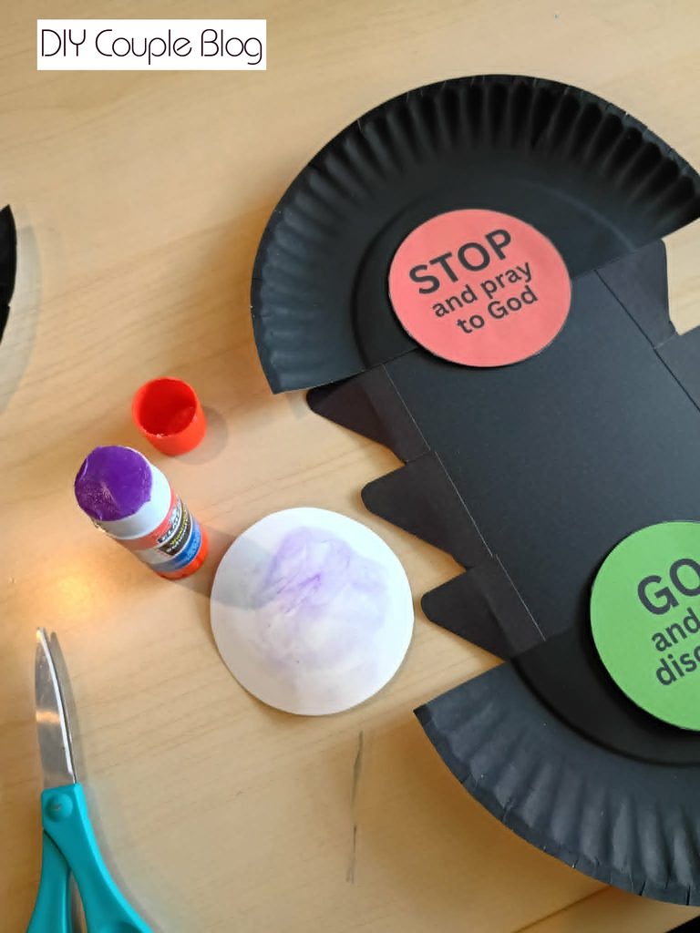 gluing the  printable red, yellow, and green "lights" to the traffic light