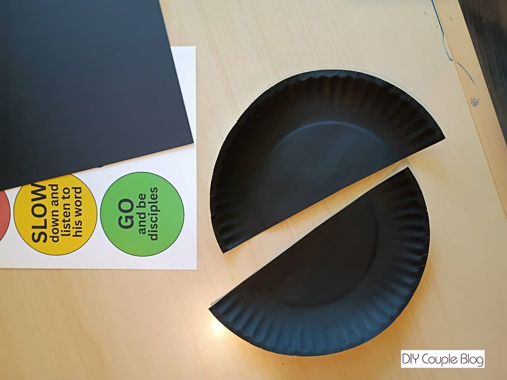 half paper plate craft with traffic signal and traffic light components 