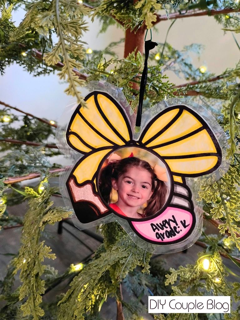 completed Christmas craft ornament after coloring, adding photo and self-laminating
