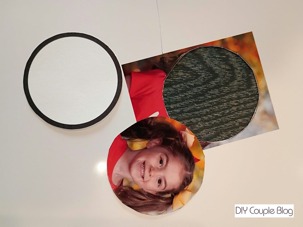 cutting out photo to place in the christmas ornament frame 